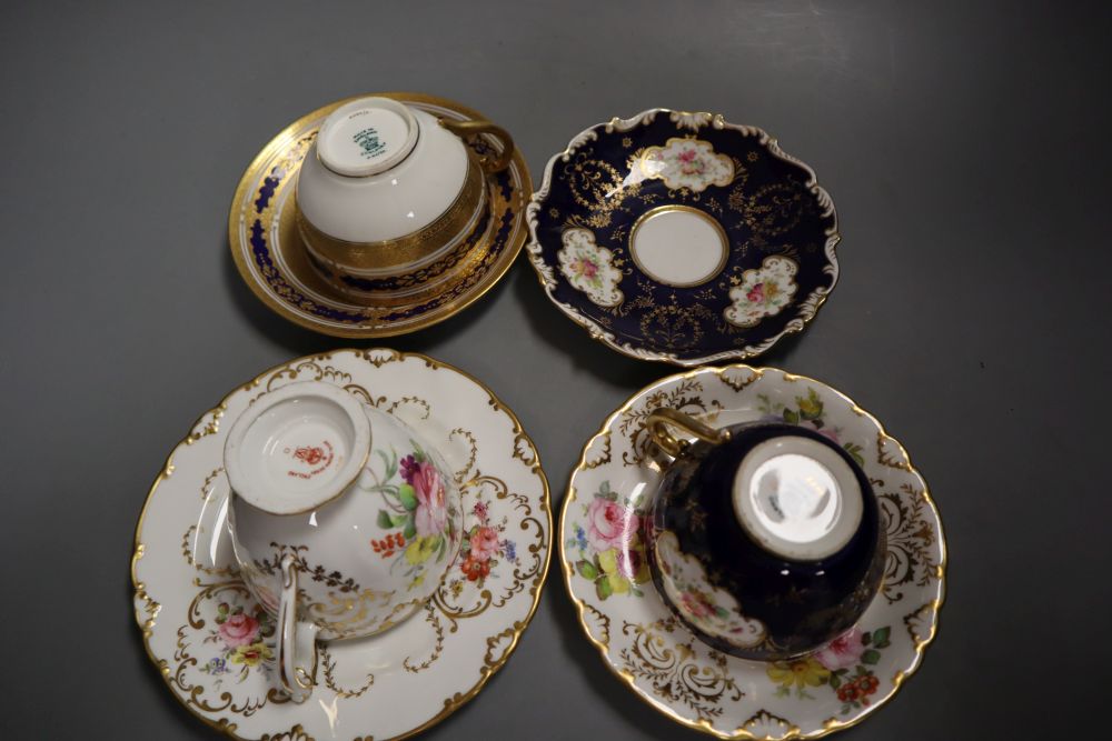 A Royal Crown Derby teacup, a saucer and a tea plate,